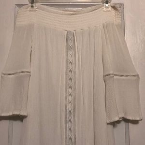 White dress with geometrical lined cut outs